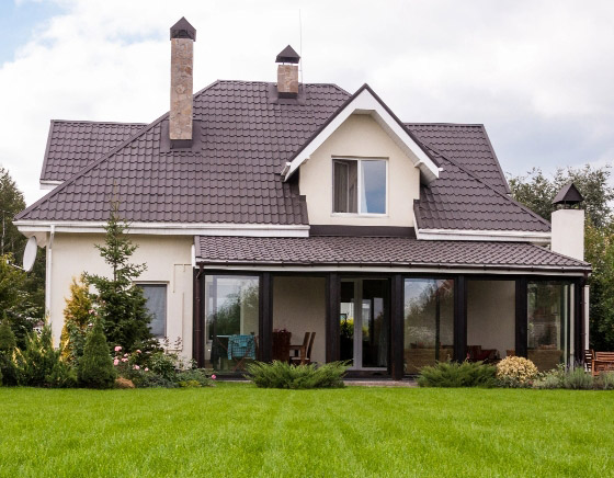 Acreage backyard with beautiful green grass